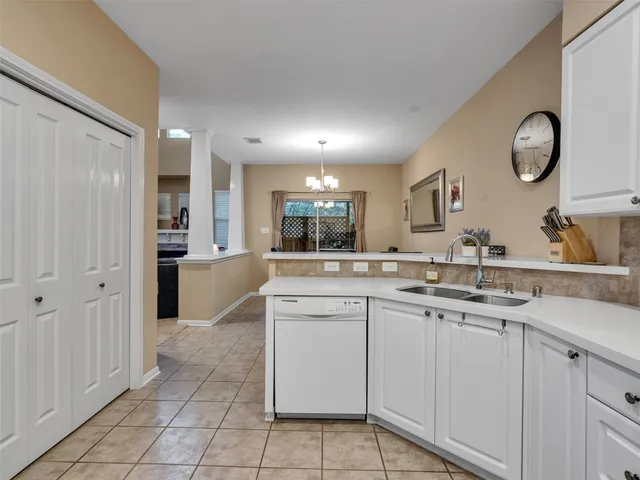 a view of a livingroom with workspace and a window