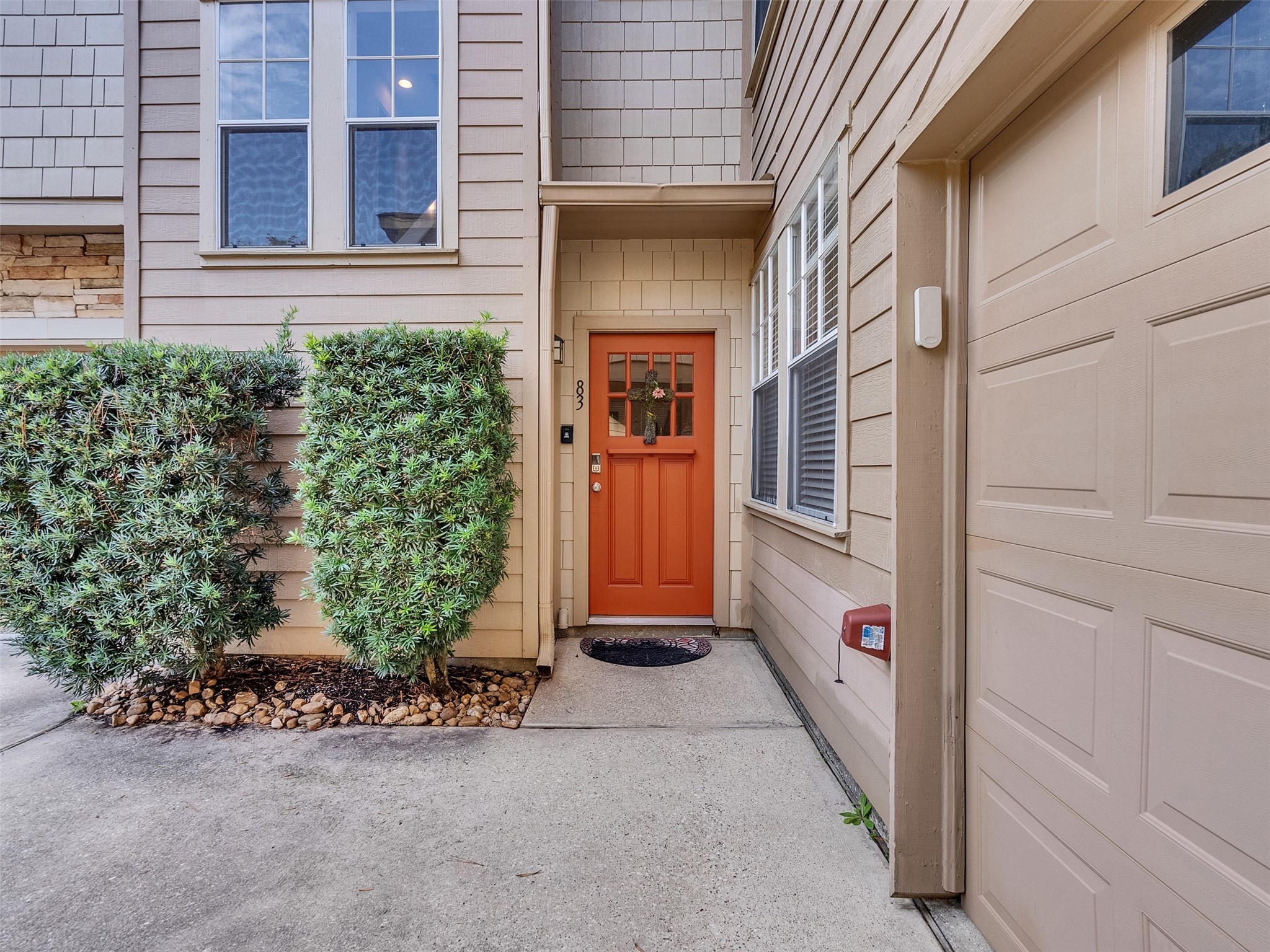 83 Scarlet Woods Court, Unit 83 The Woodlands, TX 77380 - Photo 2 of 34 Pretty and Private! The front entry is tucked into the corner with no other neighboring doors nearby.