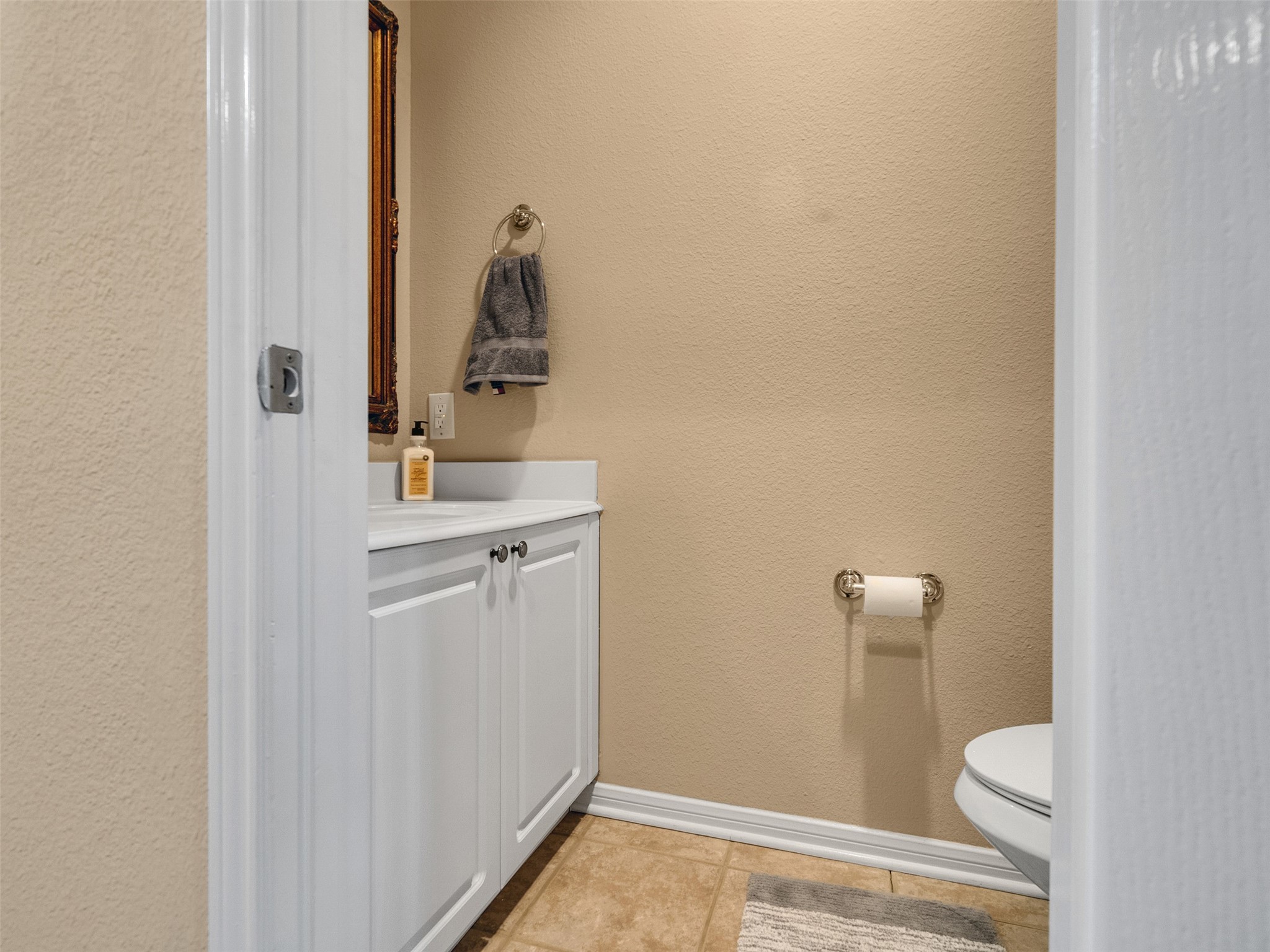 83 Scarlet Woods Court, Unit 83 The Woodlands, TX 77380 - Photo 10 of 34 Half bath downstairs