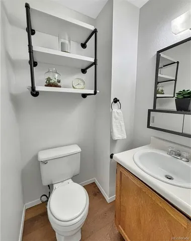 a white toilet sitting next to a bathroom sink