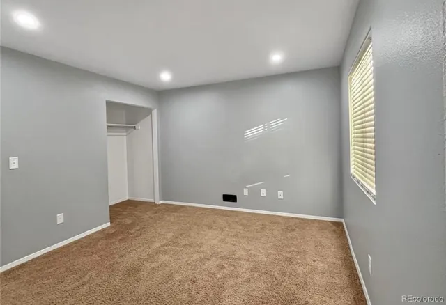 a view of an empty room and window