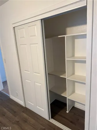 a view of an empty walk in closet