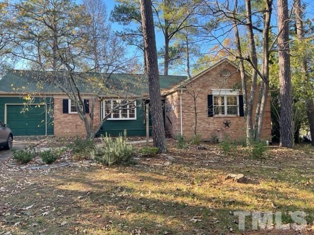 5324 Newhall Road Durham, NC 27713 - Photo 6 of 11 a view of a house with a yard