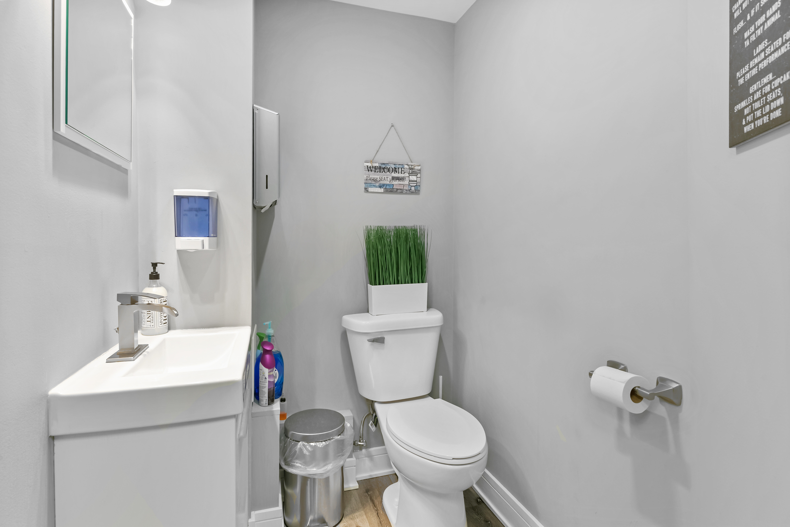 7124 West Higgins Avenue Chicago, IL 60656 - Photo 13 of 33 a bathroom with a toilet sink and mirror