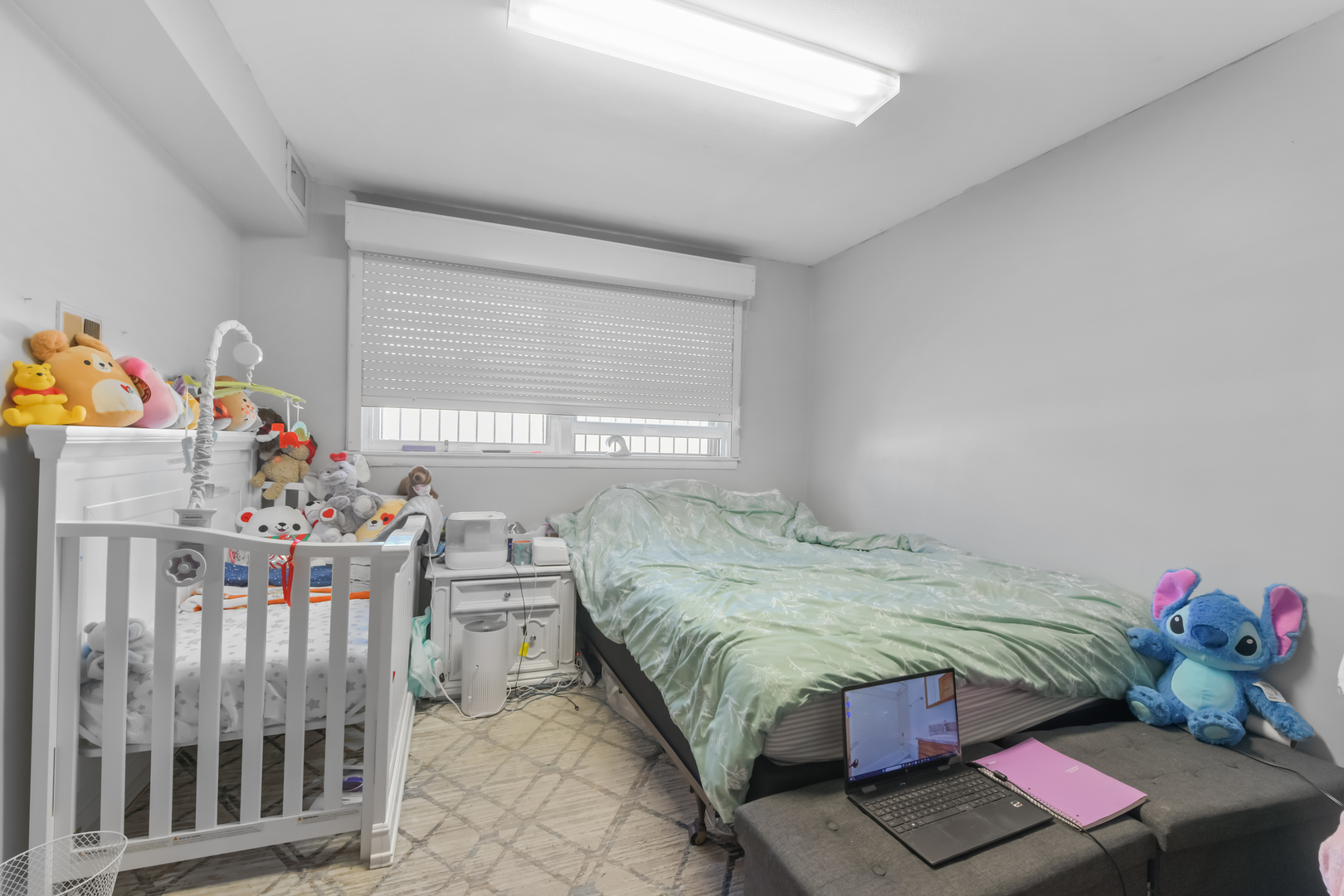 7124 West Higgins Avenue Chicago, IL 60656 - Photo 21 of 33 a bedroom with furniture and a window