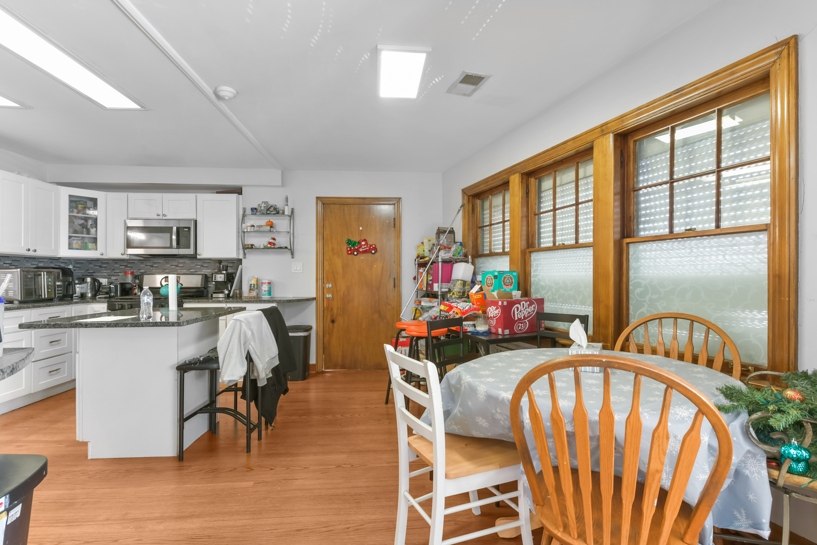 7124 West Higgins Avenue Chicago, IL 60656 - Photo 25 of 33 a view of a dining room with furniture window and wooden floor