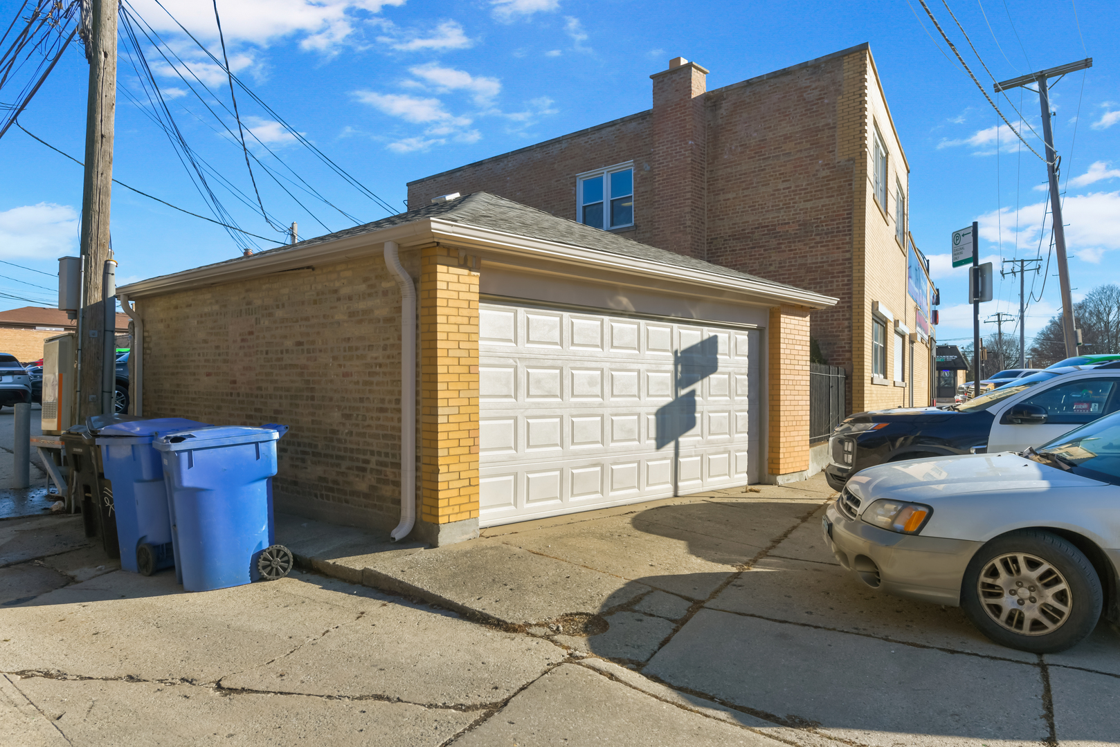 7124 West Higgins Avenue Chicago, IL 60656 - Photo 30 of 33 a front view of a house with parking area