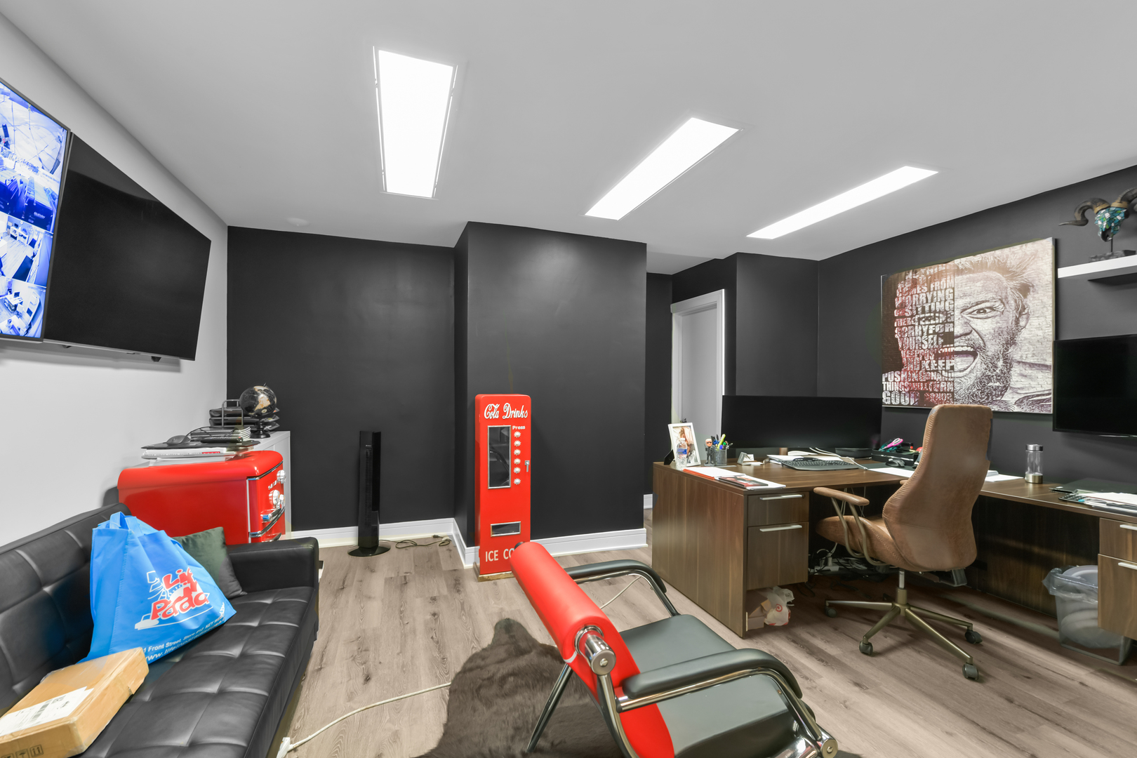 7124 West Higgins Avenue Chicago, IL 60656 - Photo 4 of 33 a work room with furniture and a flat screen tv
