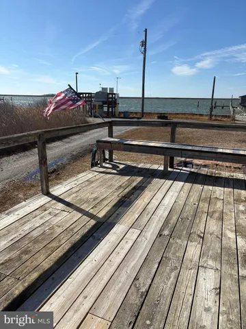 a bathroom with a granite countertop sink and a bathtub