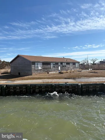 a view of a swimming pool with an outdoor seating