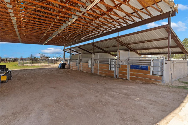 5321 South 3100th Street West Roy, UT 84067 - Photo 12 of 64 Covered open-air structure featuring exposed wood framing and a metal roof