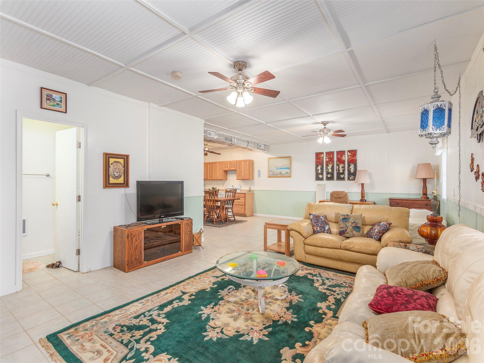 1120 Jacobs Branch Road Franklin, NC 28734 - Photo 23 of 36 a living room with furniture and a flat screen tv