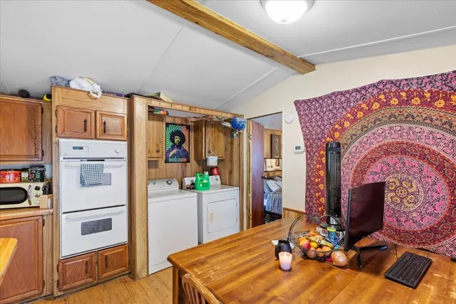 a room with furniture a flat screen tv and a fireplace