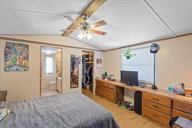 a bedroom with furniture and a chandelier