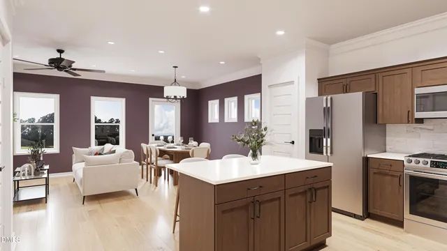 a large kitchen with a sink stove and refrigerator