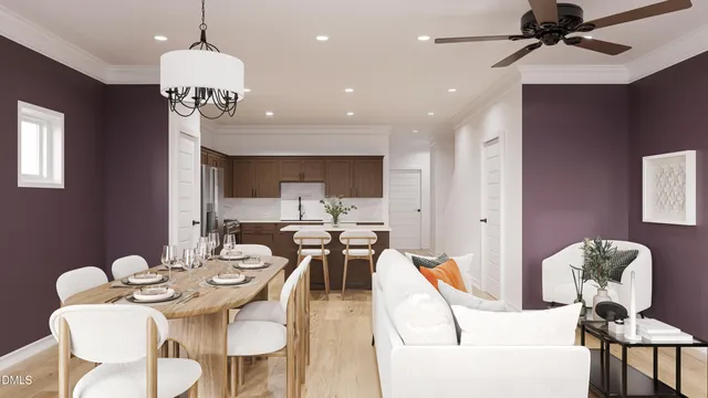 a view of a dining room with furniture a chandelier and wooden floor