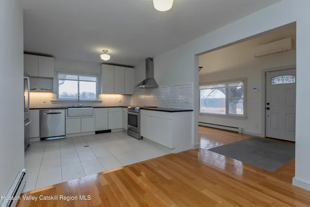 a view of a room with window and wooden floor