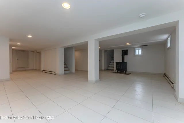 a view of swimming pool with a yard and large trees