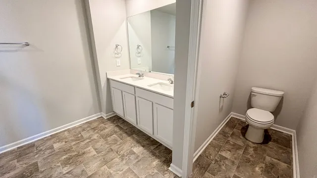 a bathroom with a sink a mirror and a shower