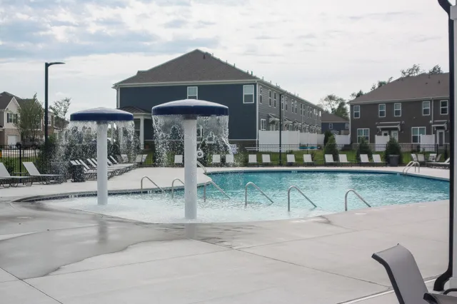 a front view of a house with a yard table and chairs