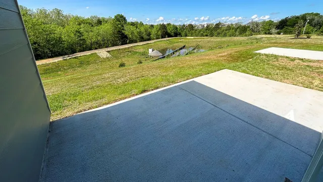a view of swimming pool with a yard