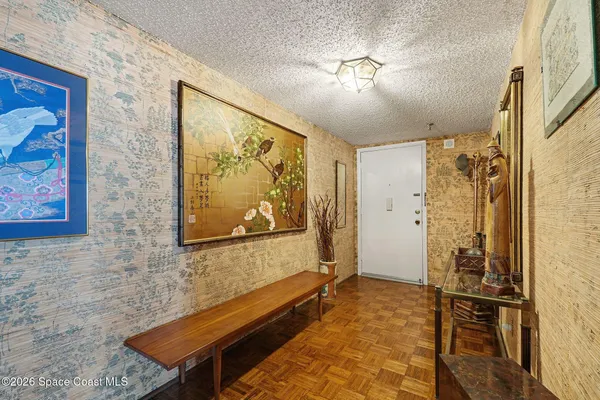 a view of a livingroom with a furniture window and wooden floor