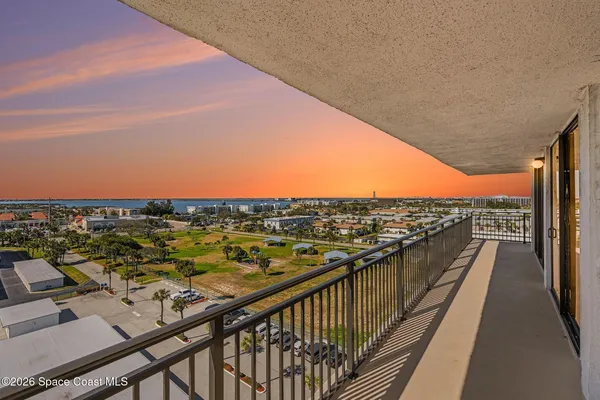 a view of a balcony with an ocean view