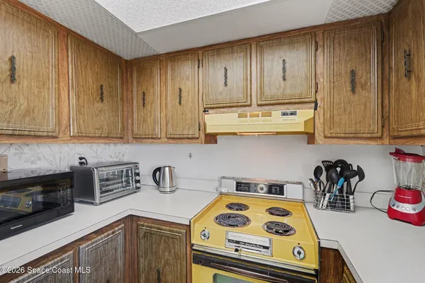 a kitchen with a cabinets and window