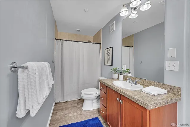 front view of a building with red flowers