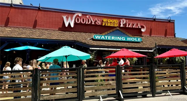 an aerial view of residential house and sandy dunes