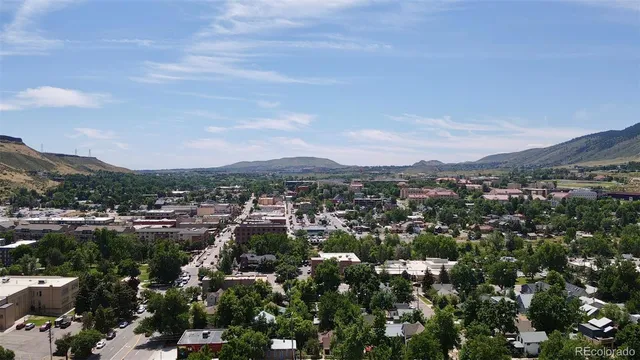 aerial view of a house with a backyard