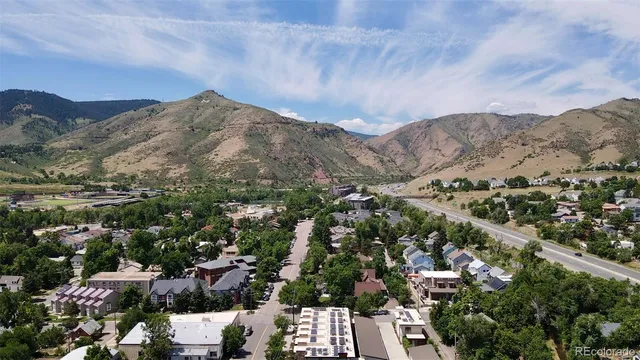a view of a building with a umbrellas on a brick wall