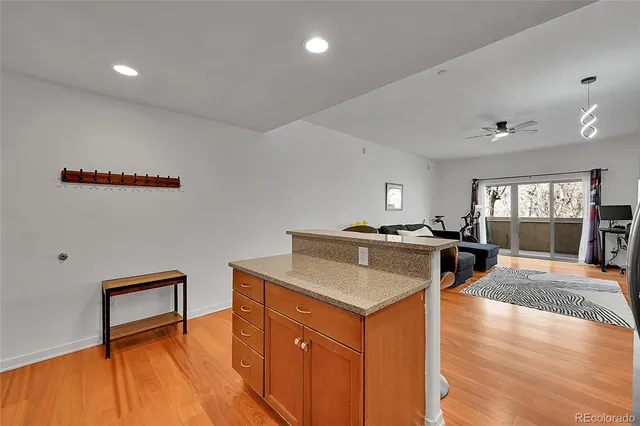 a bedroom with a bed and painting on the wall