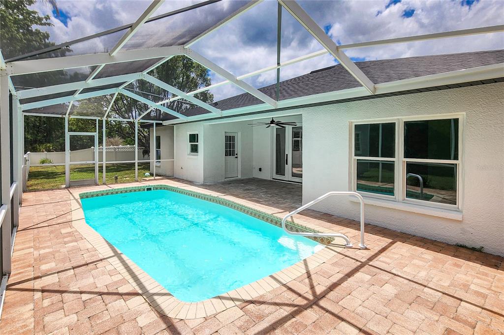 7027 Frascati Loop Wesley Chapel, FL 33544 - Photo 25 of 28 a house view with a backyard space