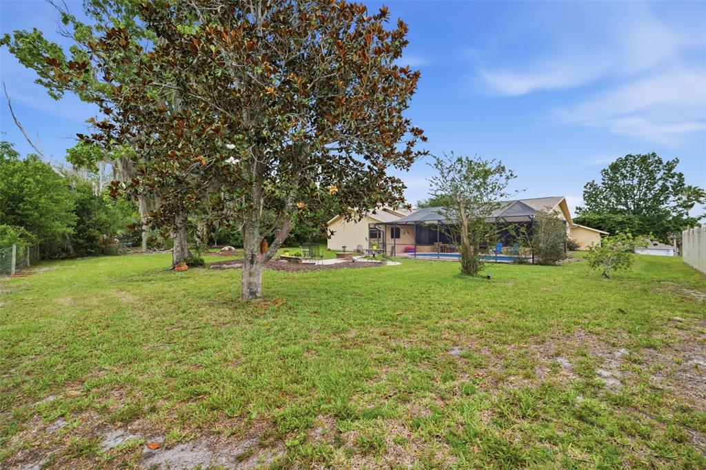 5227 Suwannee Road Weeki Wachee, FL 34607 - Photo 44 of 62 a front view of a house with a yard