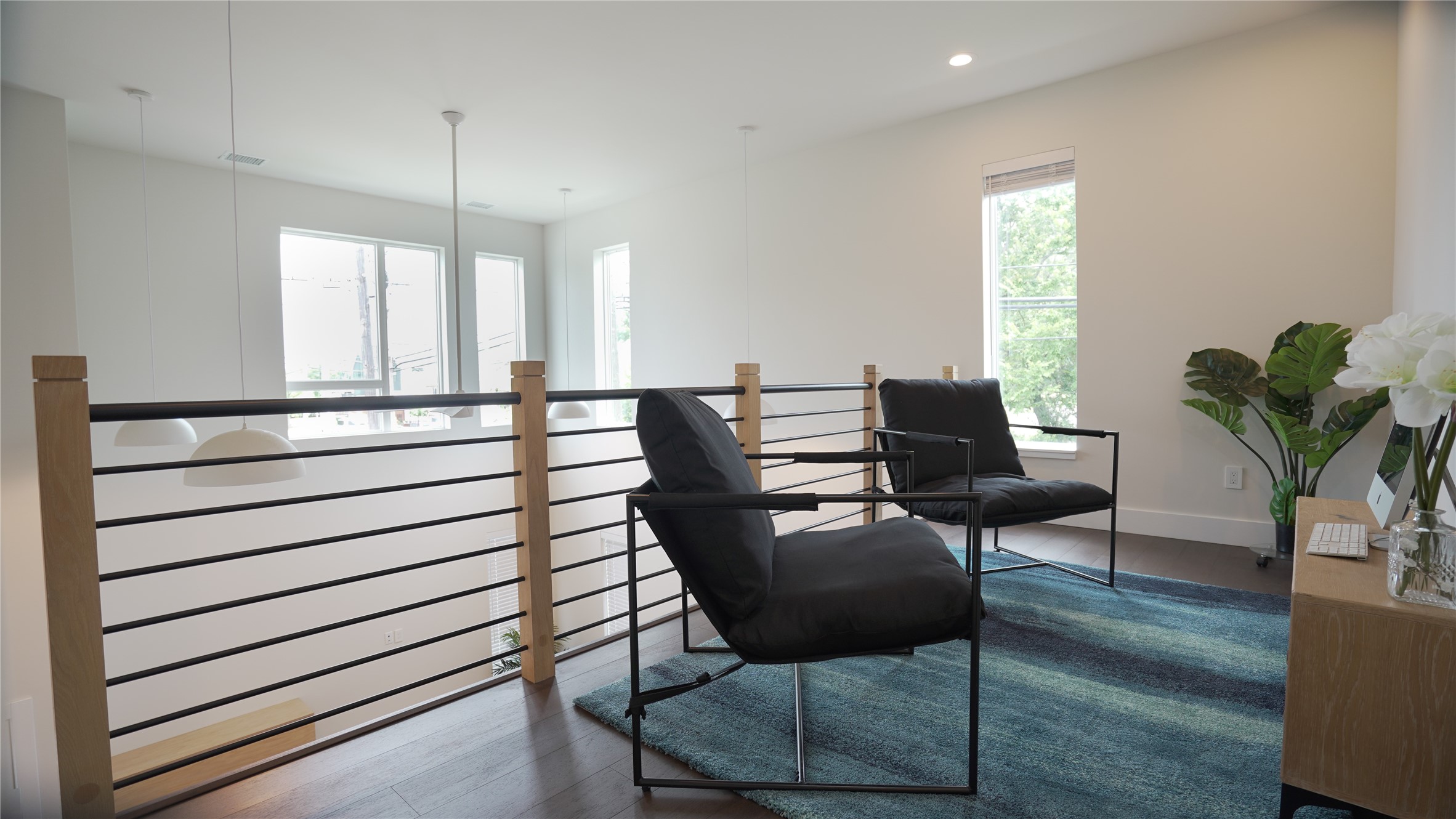 3618 Engelke Street Houston, TX 77003 - Photo 6 of 10 a view of a workspace with furniture and a potted plant