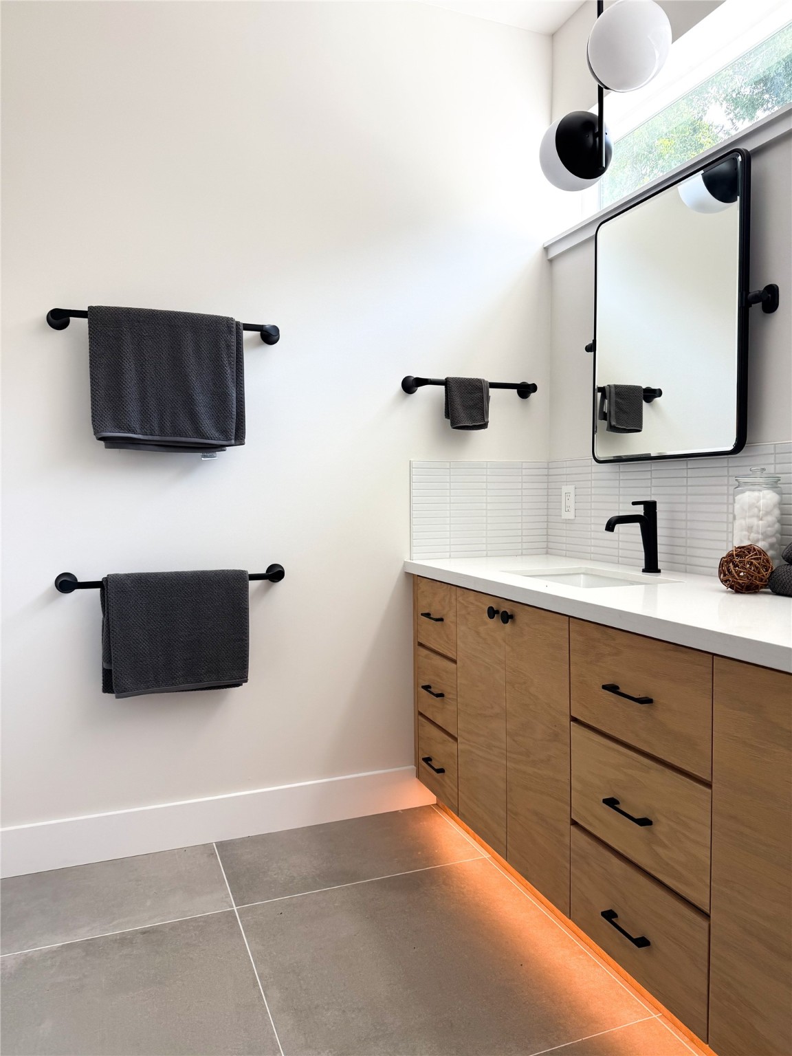 3618 Engelke Street Houston, TX 77003 - Photo 9 of 10 a spacious bathroom with a double vanity sink and a mirror