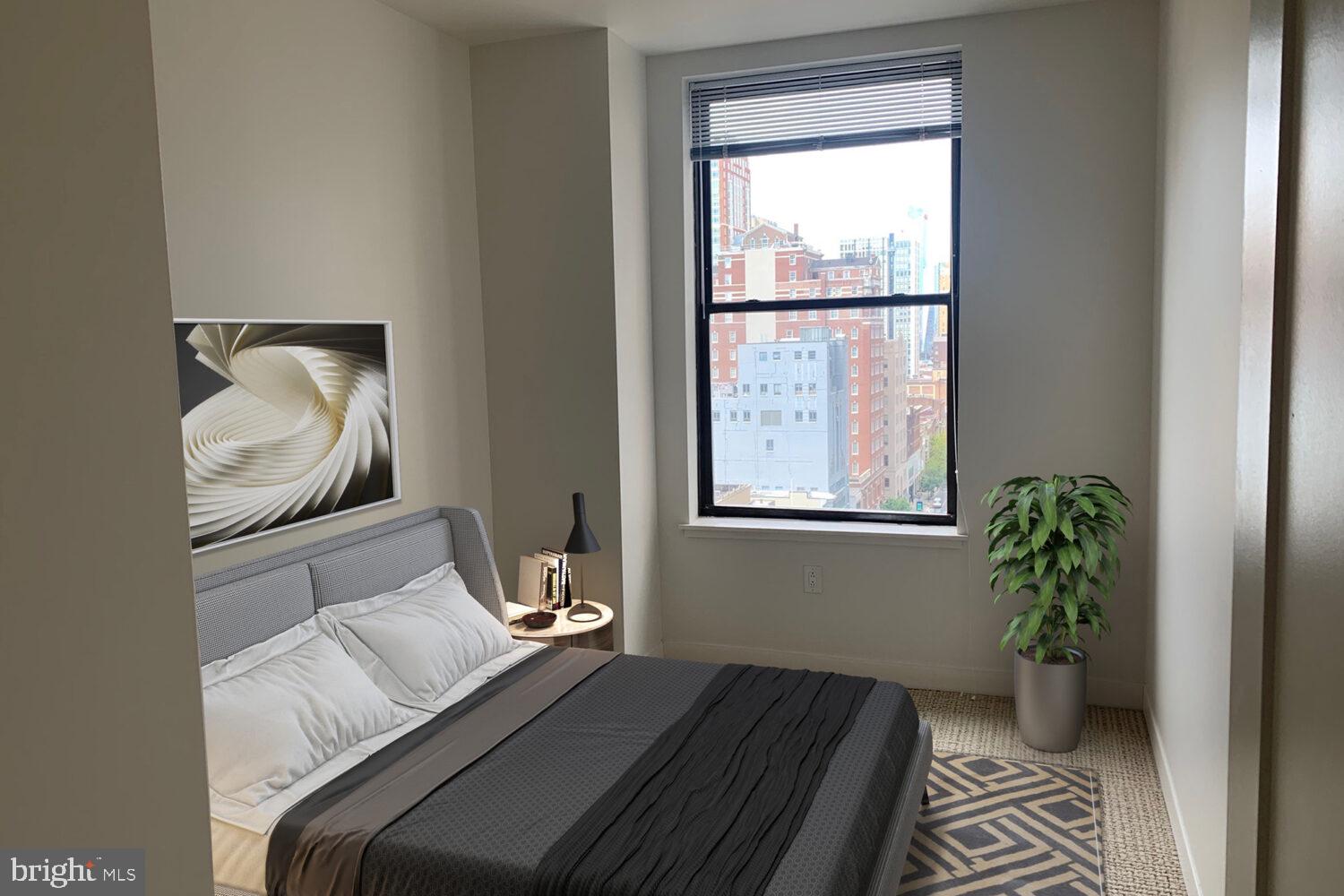 42 South 15th Street, Unit 0B1311 Philadelphia, PA 19102 - Photo 14 of 36 a bedroom with a bed and a window