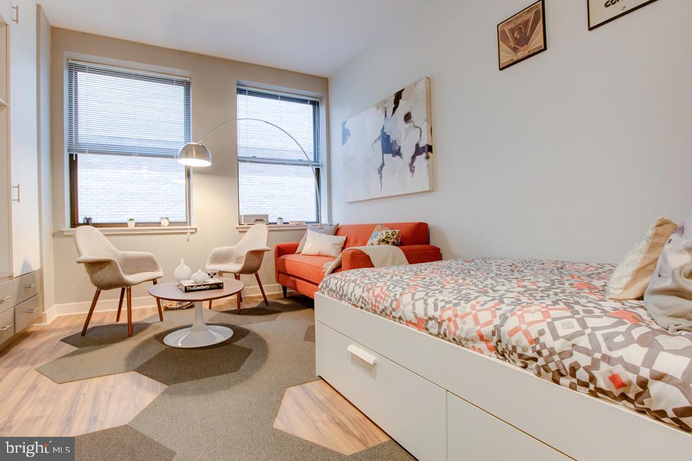 42 South 15th Street, Unit 0B1311 Philadelphia, PA 19102 - Photo 20 of 36 a bedroom with bed and a couch