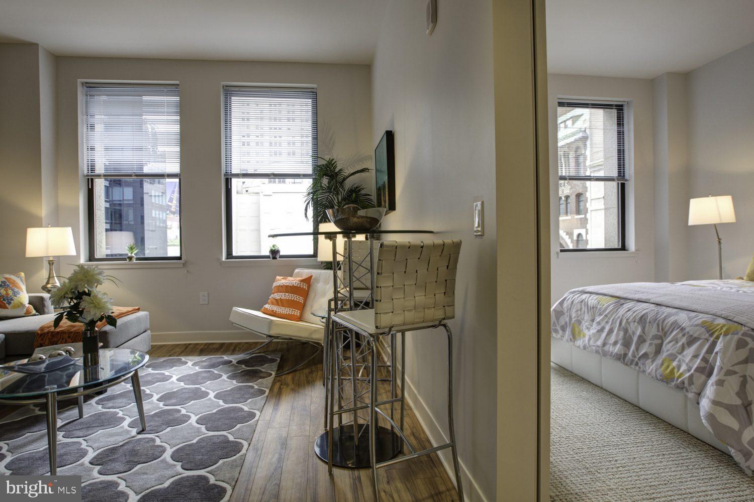 42 South 15th Street, Unit 0B1311 Philadelphia, PA 19102 - Photo 6 of 36 a living room with furniture and a window