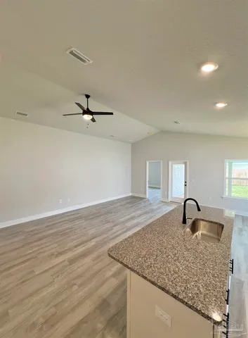 a view of a sink and cabinets