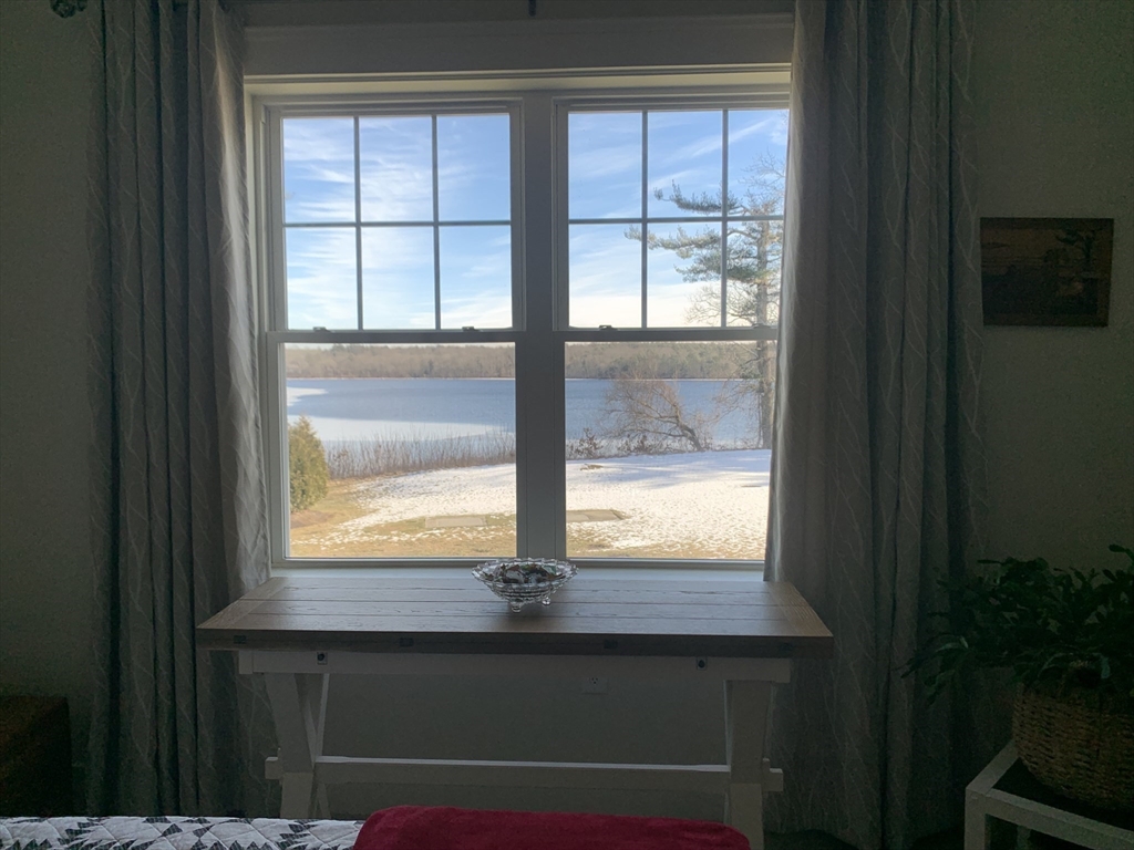 57 Long Point Road, Unit 104 Lakeville, MA 02347 - Photo 24 of 41 a view of empty room with wooden floor and a window