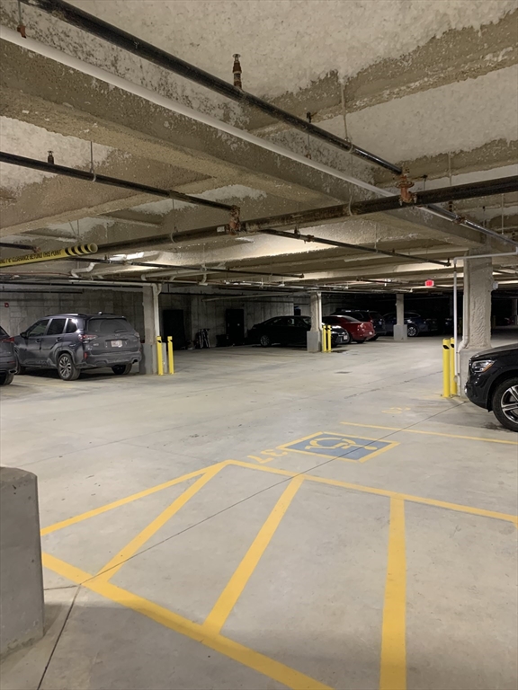 57 Long Point Road, Unit 104 Lakeville, MA 02347 - Photo 38 of 41 a view of parking garage with cars