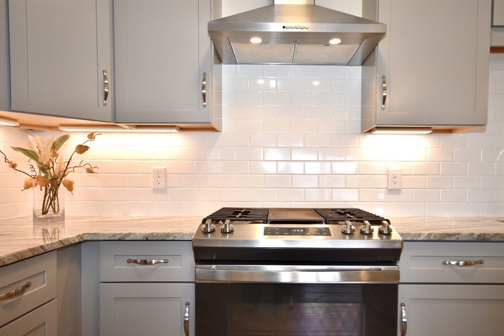 57 Long Point Road, Unit 104 Lakeville, MA 02347 - Photo 10 of 41 a stove top oven sitting inside of a kitchen