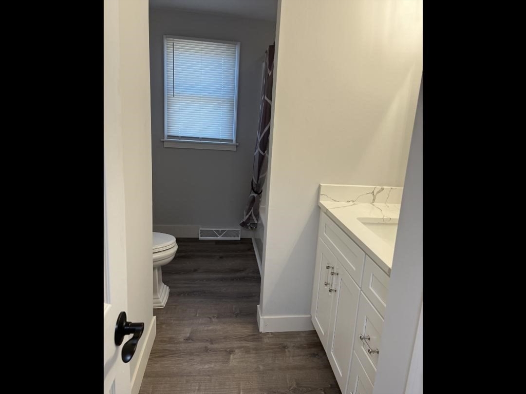 138 Jeffrey Road Springfield, MA 01119 - Photo 12 of 22 a bathroom with a granite countertop sink and a toilet