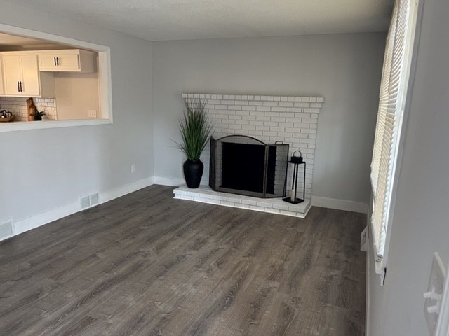 138 Jeffrey Road Springfield, MA 01119 - Photo 15 of 22 a view of empty room with wooden floor and fireplace