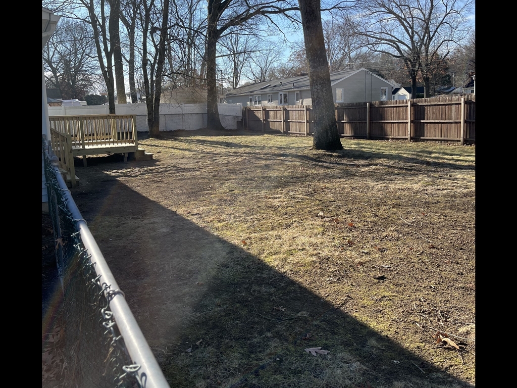 138 Jeffrey Road Springfield, MA 01119 - Photo 4 of 22 a view of a yard with a house