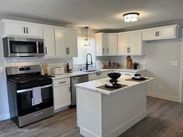138 Jeffrey Road Springfield, MA 01119 - Photo 7 of 22 a kitchen with a stove a sink and a microwave