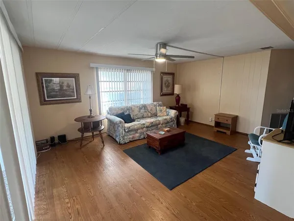 a living room with furniture and a window
