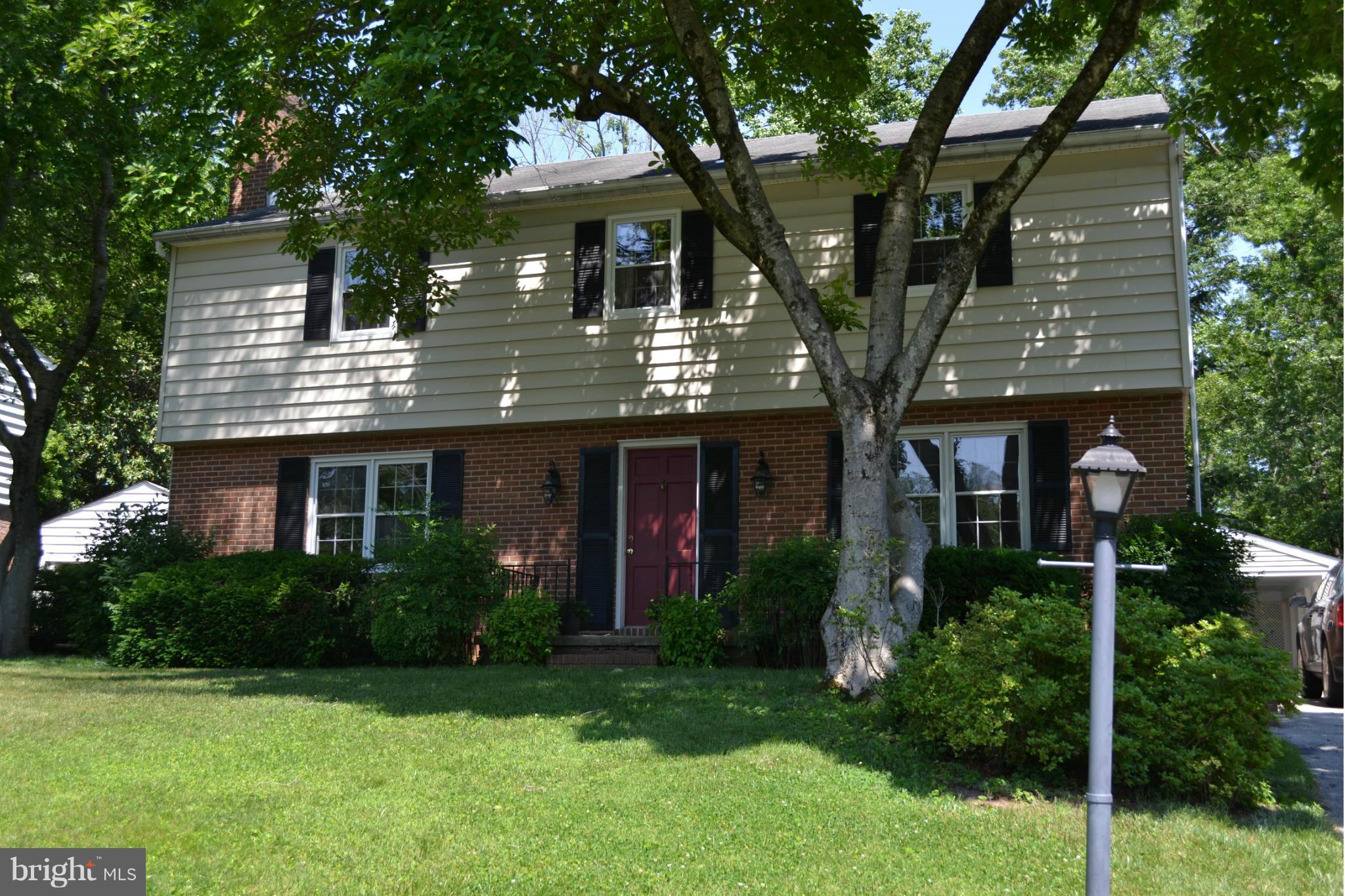 7911 Springway Road Baltimore, MD 21204 - Photo 1 of 30 a front view of house with a garden